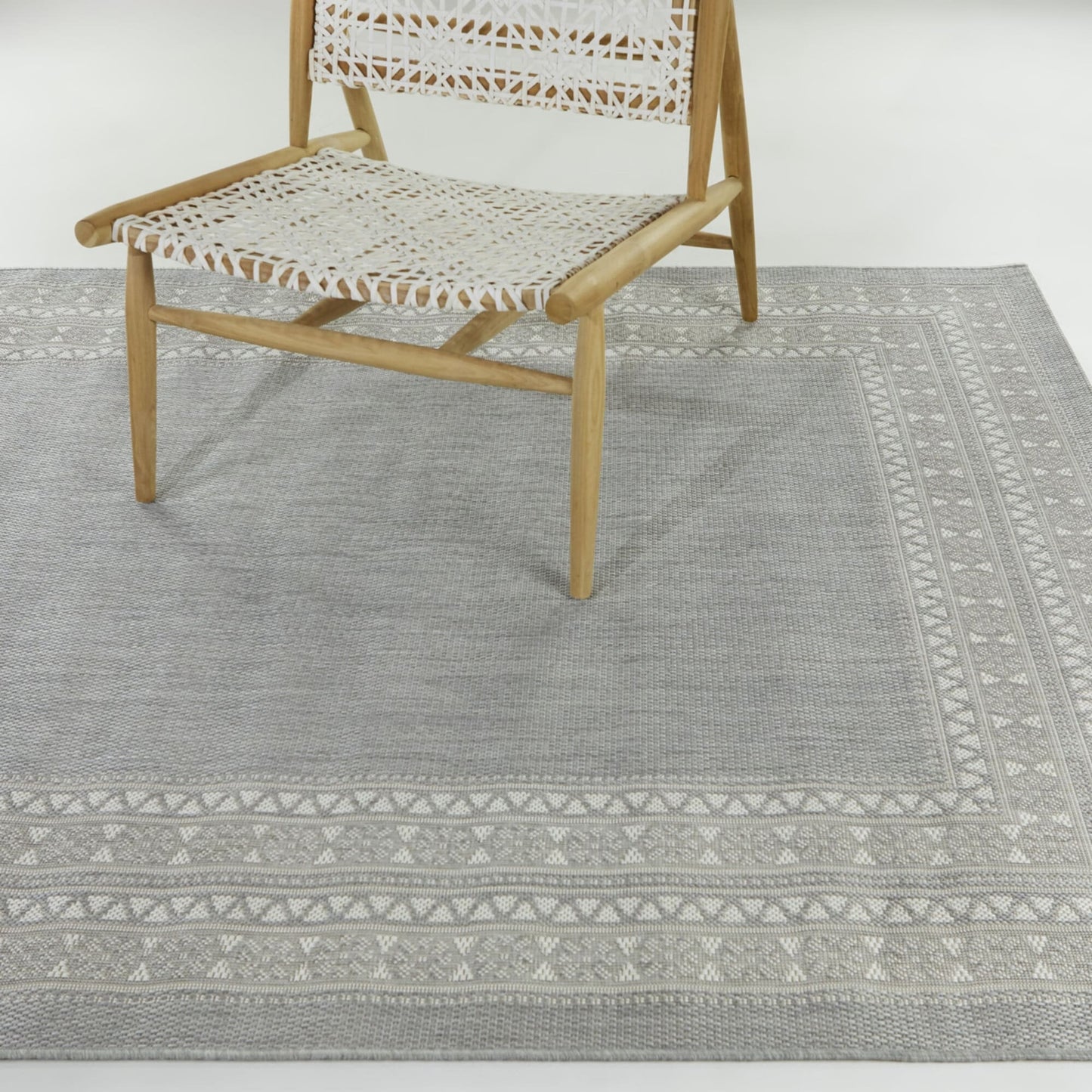 Tapis d'intérieur/extérieur à bordure transitionnelle Carew
