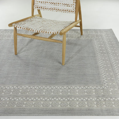 Tapis d'intérieur/extérieur à bordure transitionnelle Carew