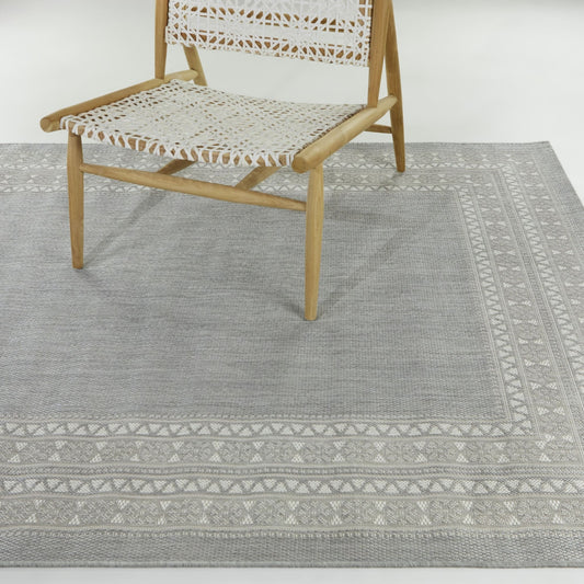Tapis d'intérieur/extérieur à bordure transitionnelle Carew