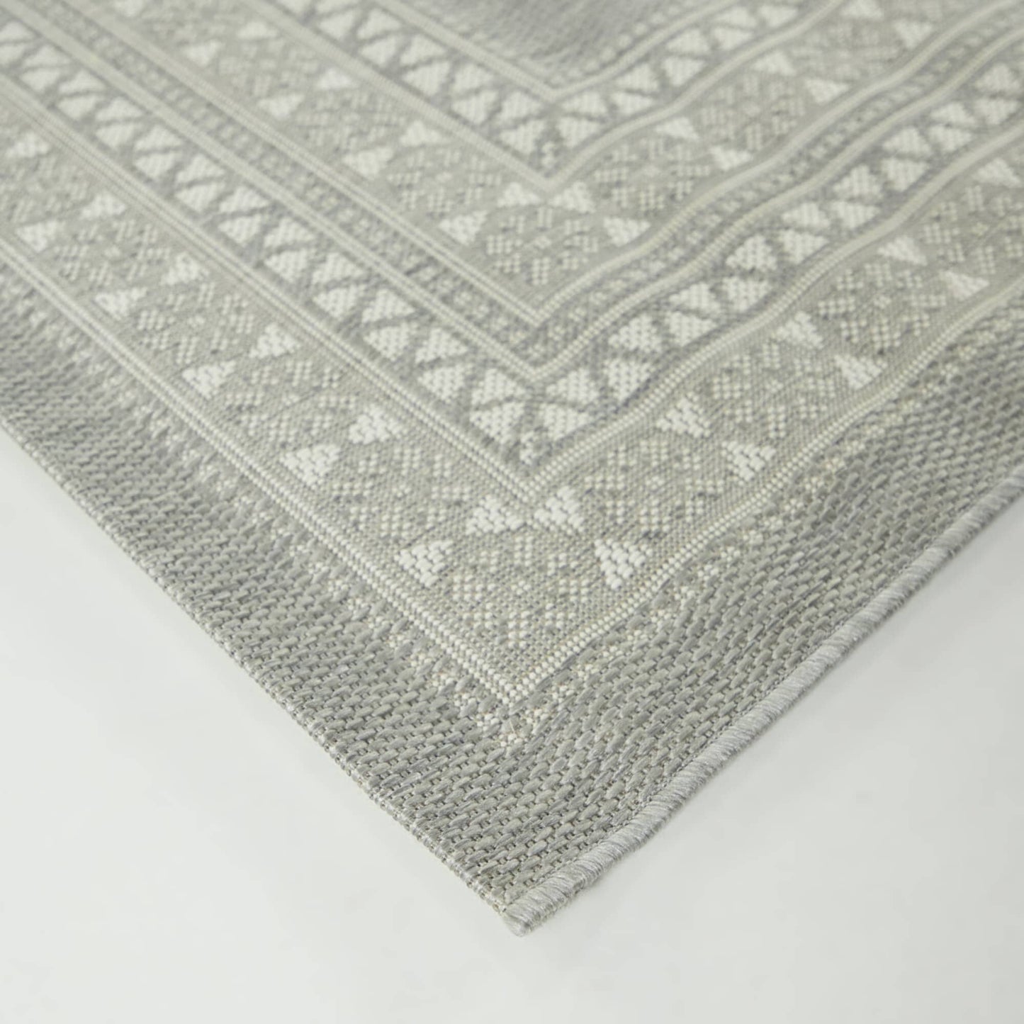Tapis d'intérieur/extérieur à bordure transitionnelle Carew