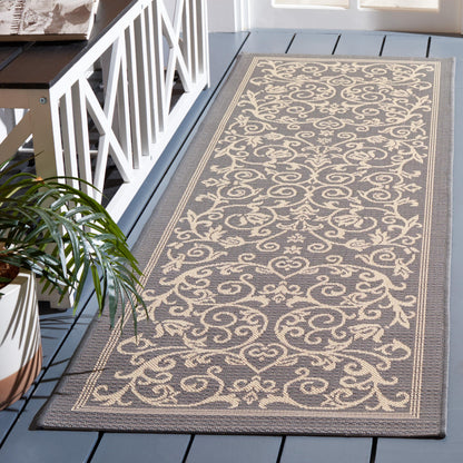 Tapis de jardin imperméable d'intérieur/extérieur SAFAVIEH Courtyard Miljeta