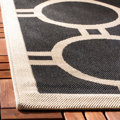 Tapis de jardin imperméable d'intérieur/extérieur SAFAVIEH Courtyard Nira