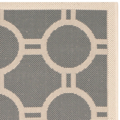 Tapis de jardin imperméable d'intérieur/extérieur SAFAVIEH Courtyard Nira