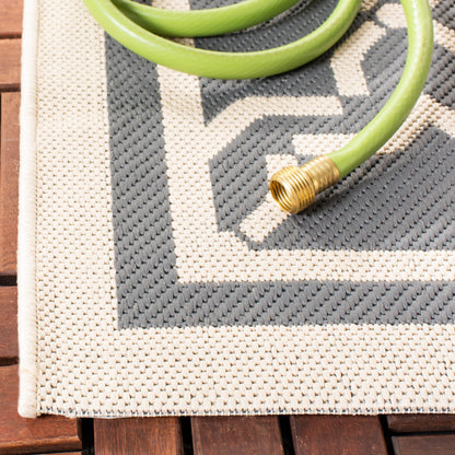 Tapis de jardin imperméable d'intérieur/extérieur SAFAVIEH Courtyard Thomasina