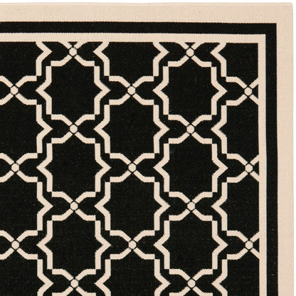 Tapis de jardin imperméable d'intérieur/extérieur SAFAVIEH Courtyard Thomasina
