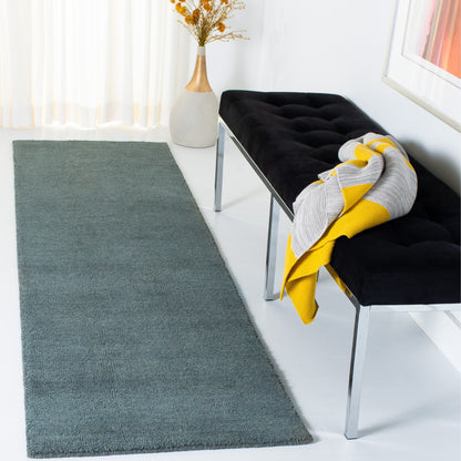 Tapis moderne en laine fait main SAFAVIEH avec bordure en palmier de l'Himalaya