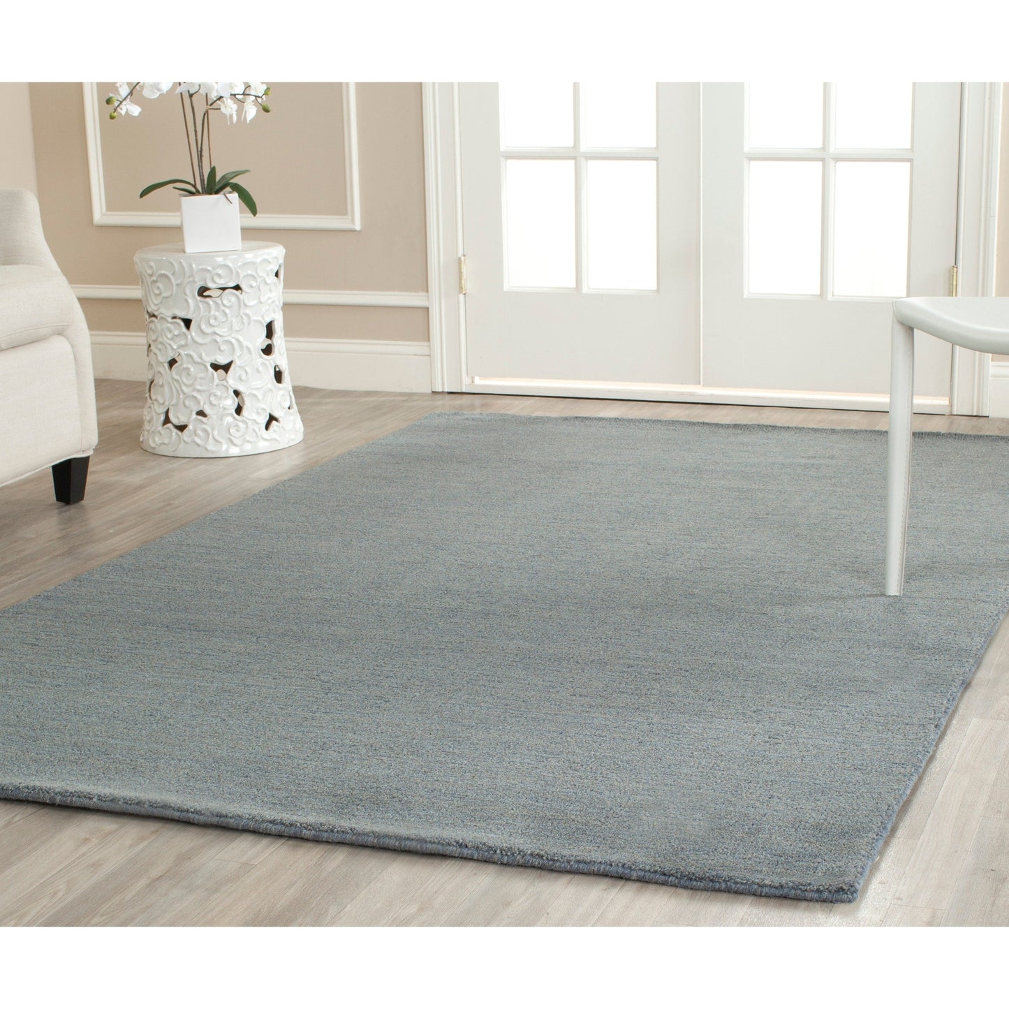 Tapis moderne en laine fait main SAFAVIEH avec bordure en palmier de l'Himalaya