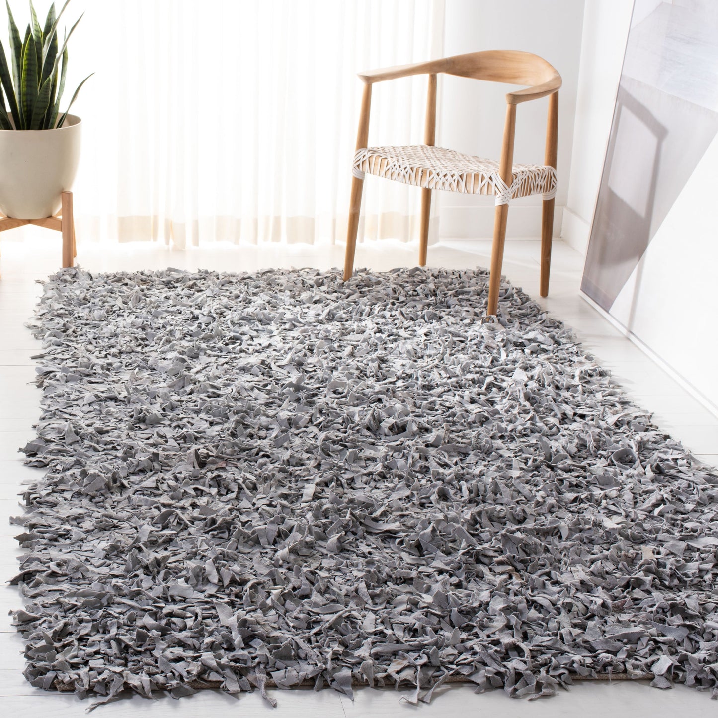 Tapis décoratif moderne en cuir fait main SAFAVIEH Shag Doinita