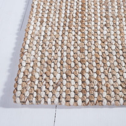 Tapis fait main en fibre naturelle Yareli en jute et laine SAFAVIEH.