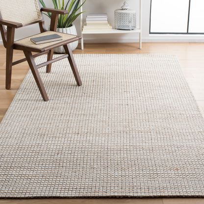 Tapis fait main en fibre naturelle Yareli en jute et laine SAFAVIEH.
