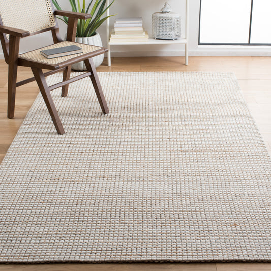 Tapis fait main en fibre naturelle Yareli en jute et laine SAFAVIEH.