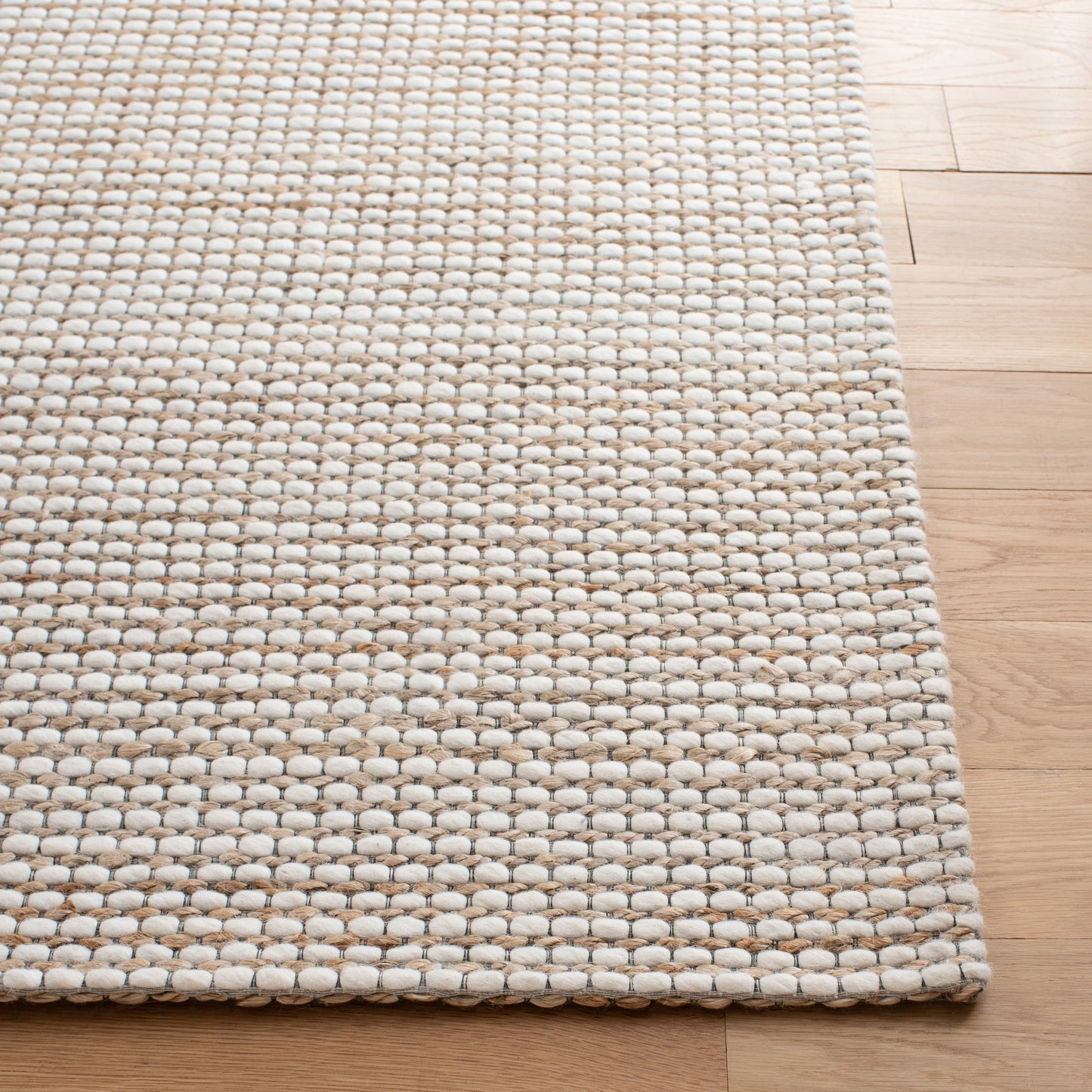 Tapis fait main en fibre naturelle Yareli en jute et laine SAFAVIEH.