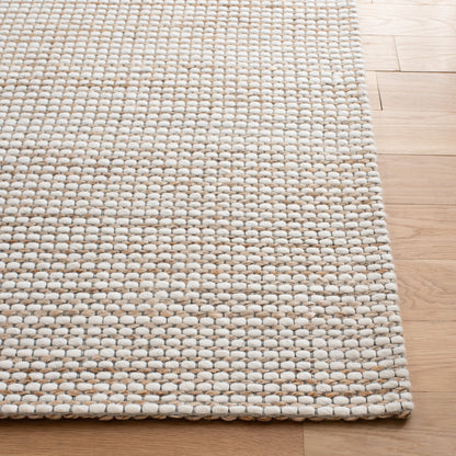 Tapis fait main en fibre naturelle Yareli en jute et laine SAFAVIEH.