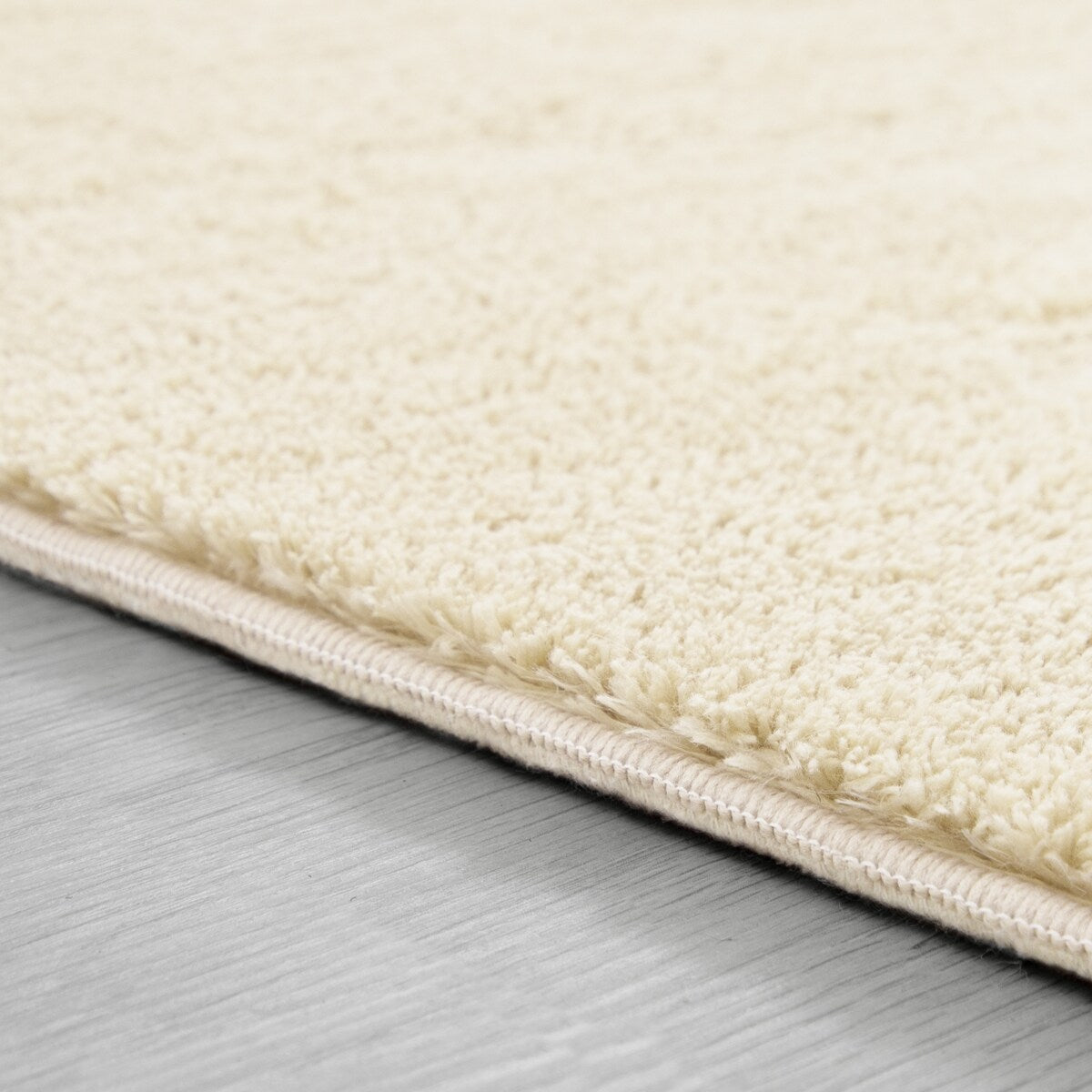 Tapis doux et lavable avec envers antidérapant, couleurs unies